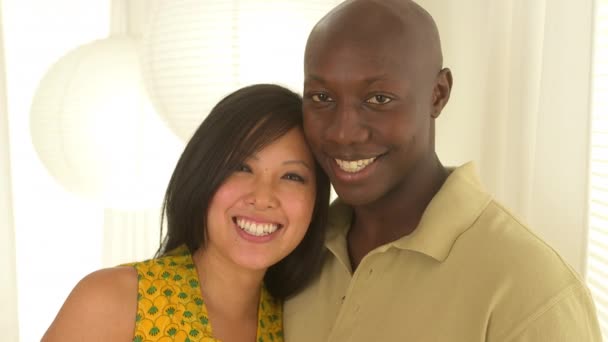 Portrait of African American and Asian couple smiling - Footage, Video