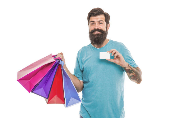 Personal discount. Buy online. Pay online. Credit card. Bearded man with bags and discount card. Purchase concept. Happy man shopping. Payment method. Bank card. Black friday sale. Satisfied customer. - Foto, Bild