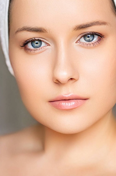 Skin care and beauty routine, beautiful woman with white towel wrapped around head, skincare cosmetics and face cosmetology, close-up portrait - Photo, Image