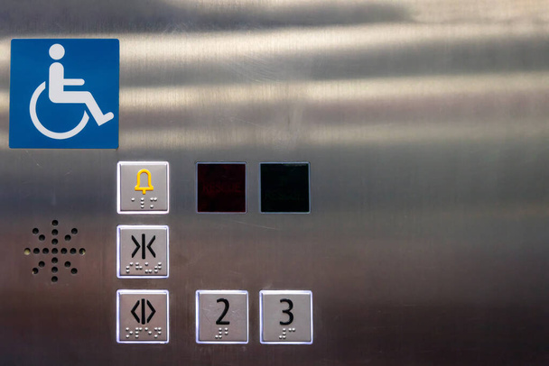 Image of disabled lift button. Stainless steel elevator panel push buttons for blind and disability people. Push Button For the disabled. Care and technology. Elevator buttons for disabled people. - 写真・画像