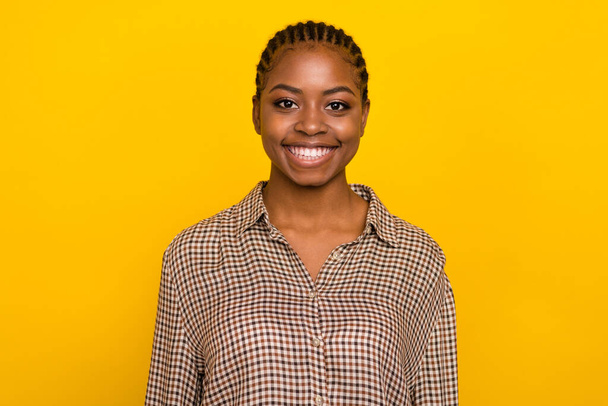 Photo of charming adorable young lady wear plaid shirt smiling isolated yellow color background. - Φωτογραφία, εικόνα