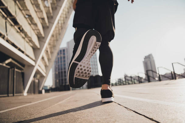 Cropped photo of leather sole quality sport footwear on running energetic man motivation concept urban town outdoors. - 写真・画像