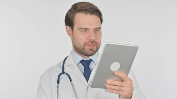 Video Call on Tablet by Young Adult Doctor on White Background - Zdjęcie, obraz