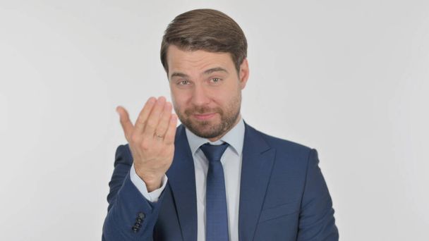 Young Adult Businessman Pointing at Camera, Inviting on White Background - Foto, Bild