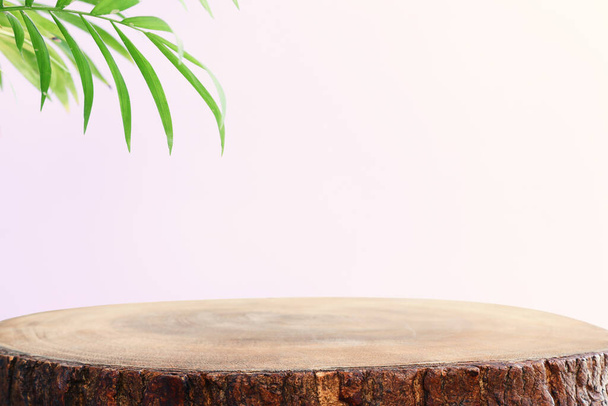 wooden table in front of interior wall and tropical green plant background. for product display and presentation. - Fotoğraf, Görsel