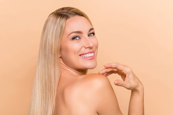 Back rear spine photo of lady touch shoulder hand enjoy ideal perfect peeling lift skin isolated over beige pastel color background. - Fotoğraf, Görsel