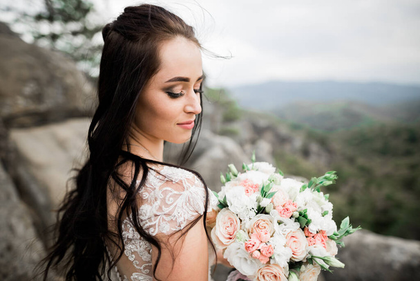 Bride holding big and beautiful wedding bouquet with flowers. - Zdjęcie, obraz