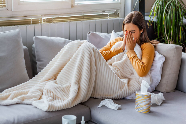 Cold And Flu. Portrait Of Ill Woman Caught Cold, Feeling Sick And Sneezing In Paper Wipe. Closeup Of Beautiful Unhealthy Girl Covered In Blanket Wiping Nose. Healthcare Concept. High Resolution - Photo, image