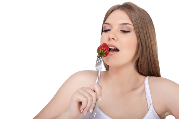 Woman eating strawberry - Фото, зображення