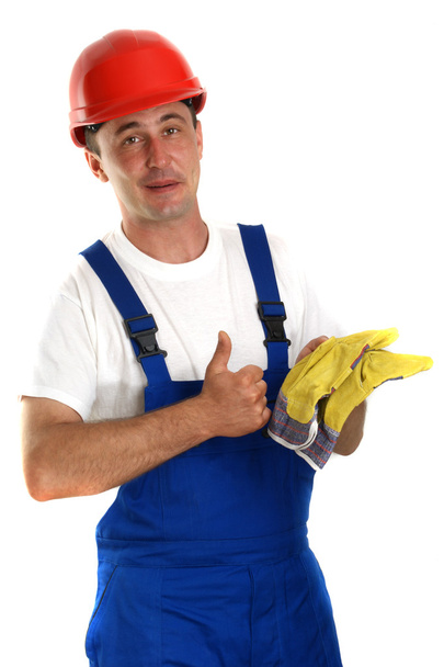 Artisan avec casque de sécurité rouge et gants de protection
 - Photo, image