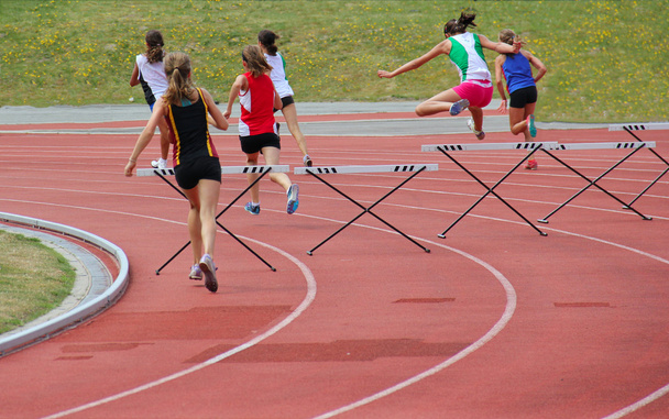Girls running 200 meter hurdles - Photo, Image