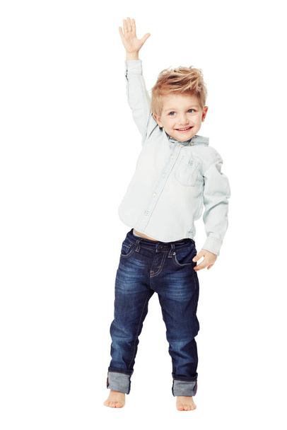 Growing up big and tall. A cute little boy reaching upwards - isolated - Foto, imagen