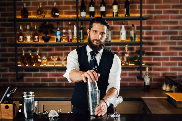 caucasian bartender preparing cocktails in bar - Fotografie, Obrázek