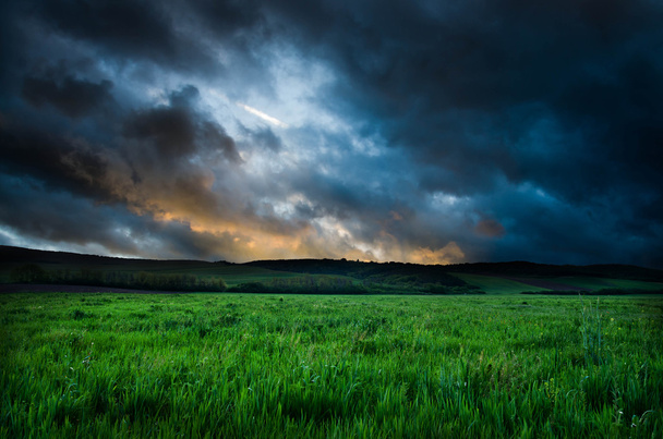 Field and dramatic sky view - Photo, Image