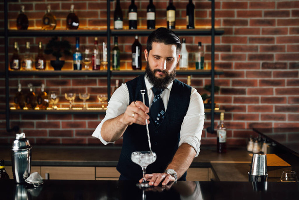 barman preparing cocktail in bar - 写真・画像