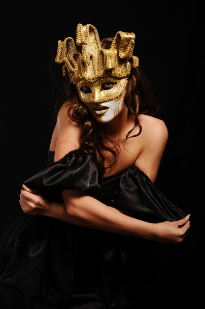 Sexy woman in golden party mask - Foto, imagen