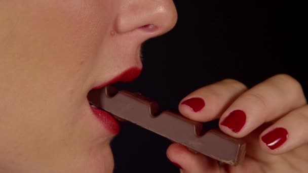 Taking a bite of chocolate - Footage, Video