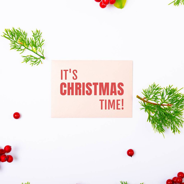 Composition of merry christmas text over christmas decorations. Christmas and celebration concept digitally generated image. - Foto, imagen