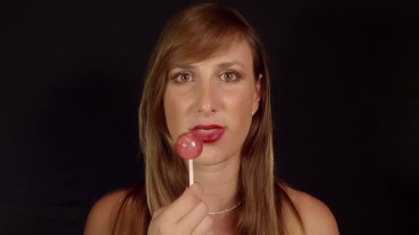 Woman licking lollipop - Footage, Video