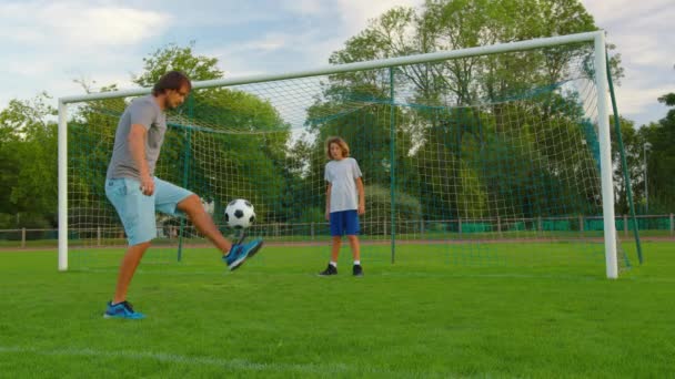 Sportsman is in control of ball. Boy with soccer ball. Boy juggles soccer ball. Child dream of football match. Sports training in park. Child juggles ball. Healthy lifestyle. High quality 4k footage - Footage, Video