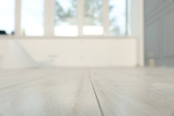 Empty room with new white laminated flooring, closeup - Zdjęcie, obraz