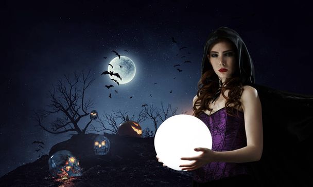 Beautiful young woman in witches hat and costume. Halloween art design. Mixed media - Foto, Imagen