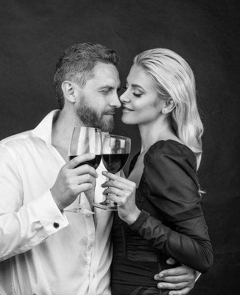 couple in love. couple drink champagne. celebrate special occasion. love romantic date. mature man in unbuttoned shirt and elegant woman. happy valentines day. business corporate party. cheers. - Foto, imagen