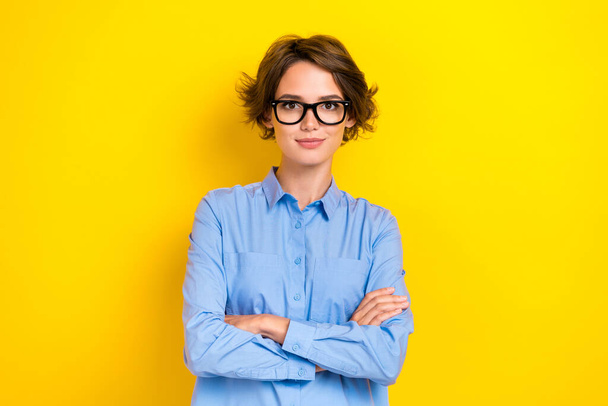 Photo of young attractive serious confident woman folded arms wear eyeglasses business career owner company isolated on bright yellow color background. - 写真・画像