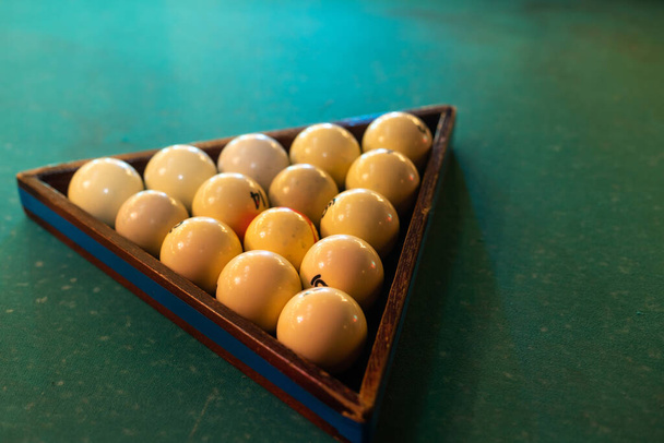 White billiard balls for billiards, a triangle on the table. White billiard balls for billiards on a blue background - Photo, image