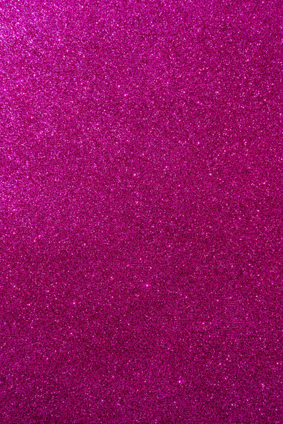 Background with sparkles. Backdrop with glitter. Shiny textured surface. Vertical image. Dark pink. Soft light - Valokuva, kuva
