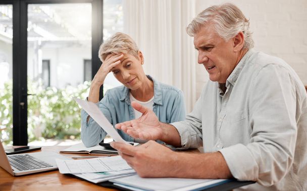 Sad retirement couple, finance debt and anxiety in financial planning, mortgage home loan and paper bills. Stress woman, angry man and senior people pension problem, admin crisis and budget mistake. - Foto, Imagen