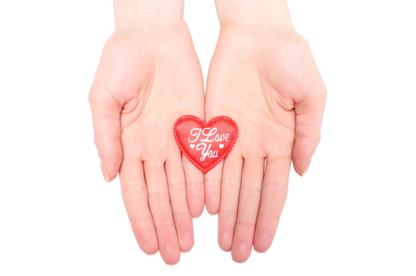 Hands of woman holding red heart. White background - Photo, Image