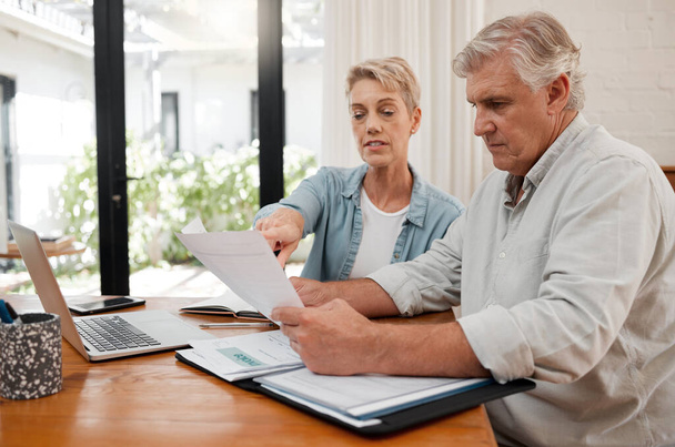 Retirement couple budget, finance and investment planning, loan and paper bills for online banking at home. Senior man, woman and people reading tax money report, cash savings and admin document note. - Fotografie, Obrázek