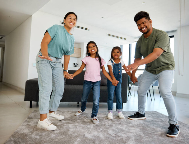 Happy family, love and dance portrait of children, mom and dad having fun, bond and enjoy quality time together. Happiness, energy and smile from Malaysia family kids and parents in home living room. - Fotografie, Obrázek
