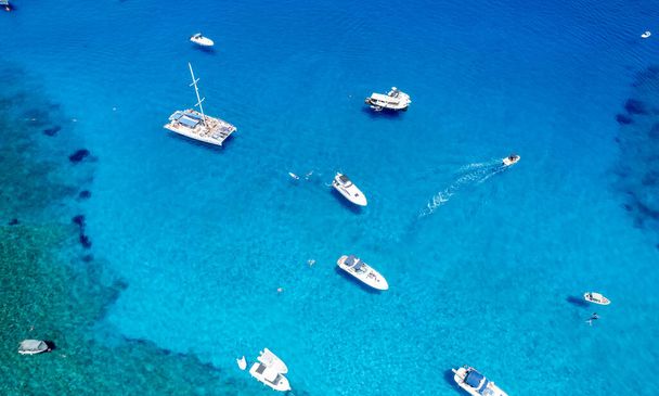 Drone aerial seascape with luxury yachts moored on the coast and unrecognised people swimming and relaxing. Summer vacations in the sea. Ayia Napa Cyprus - Foto, Imagem