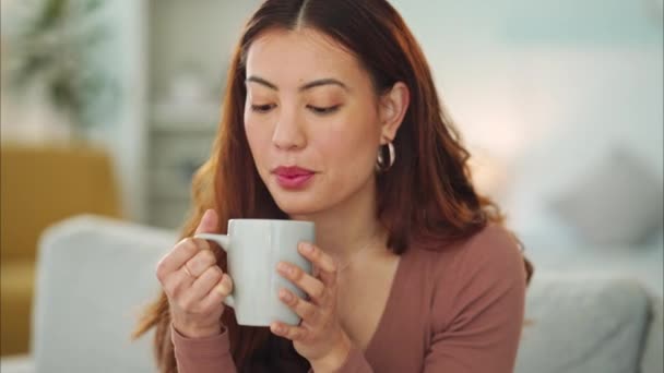 Coffee break and woman on home sofa with espresso, cappuccino or hot chocolate drink. Calm, self love and relax person with tea beverage in living room lounge for free time or winter weekend alone. - Footage, Video