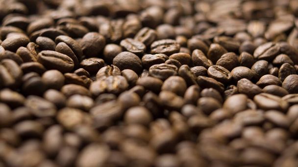 Закрыть макро кофейных зерен подробно жареные зерна текстуры боке - Фото, изображение