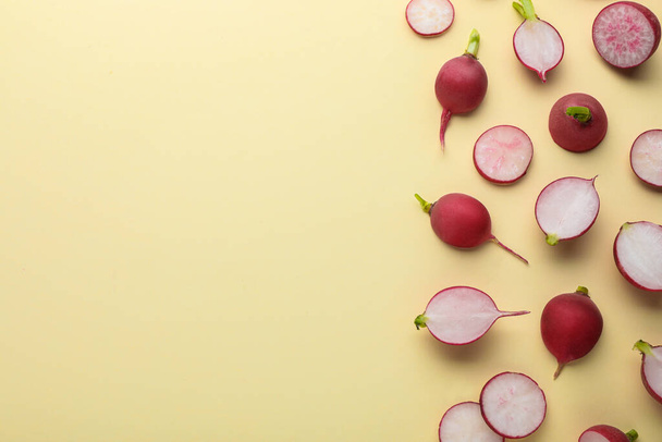 Fresh ripe radish on beige background, flat lay. Space for text - 写真・画像