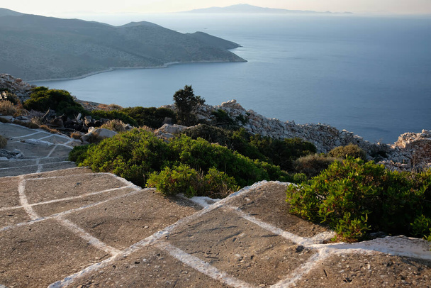 Steps leading down at the Paleokastro Monastery and view of the Aegean Sea in Ios Greece - Fotó, kép