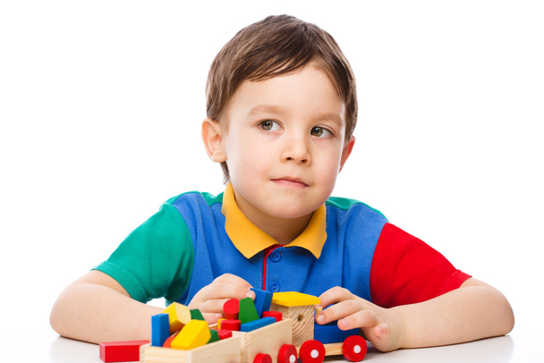 Boy is playing with building blocks - Foto, Imagem
