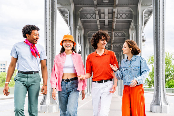 Group of young happy friends visiting Paris and Eiffel Tower, Trocadero area and Seine river - Multicultural group of tourists sightseeing the France capital city - Photo, Image