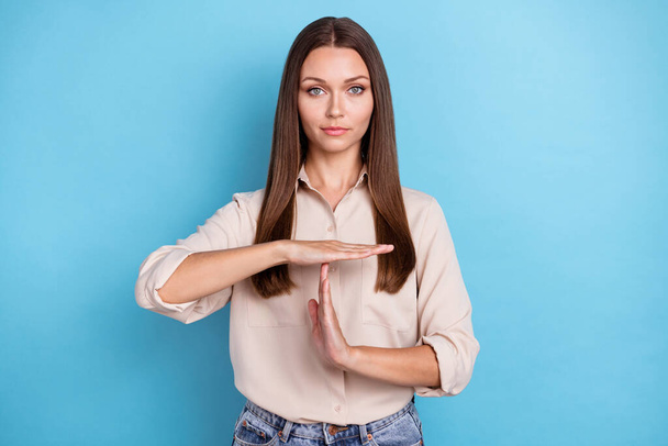 Photo portrait of attractive young lady arms show time out stop sign wear stylish smart casual garment isolated on blue color background. - Photo, Image
