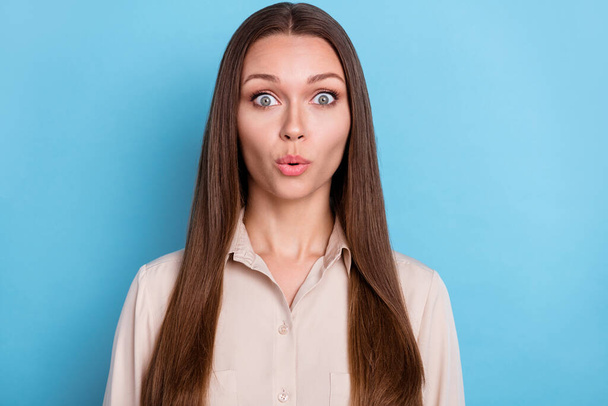 Photo of adorable gorgeous stunning woman with straight hairstyle dressed beige blouse eyes wide open isolated on blue color background. - Φωτογραφία, εικόνα