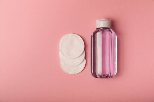 Micellar cleansing water and cotton pads on a pink background, top view. Place for text. Flat lay.MOCAP - Photo, Image