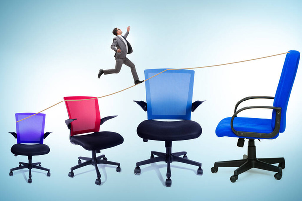 Promotion concept with the businessman and chairs - Photo, Image
