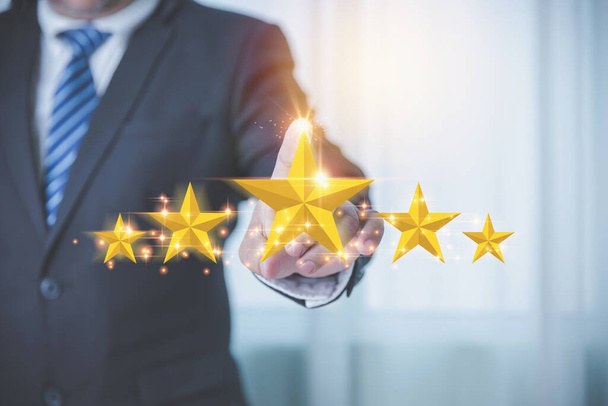 Businessman touching on five stars for feedback evaluation satisfaction white background. Customer service evaluation and satisfaction concept. Rating to excellent the popular service with copy space. - Valokuva, kuva