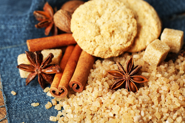 Christmas spices and baking ingredients on wooden background - Foto, afbeelding