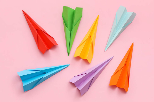 Colorful paper planes on pink background - Fotó, kép