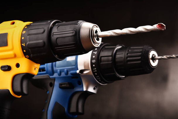 Two cordless drills with drill bits working also as screw guns. - Photo, Image