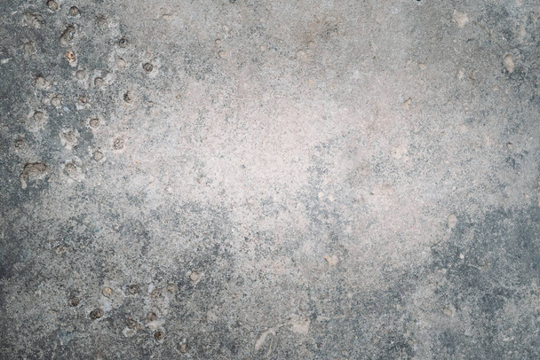 Stony background. Gray concrete texture. Retro wall. Grunge aged surface with damages and holes copy space for text logo. - Photo, Image